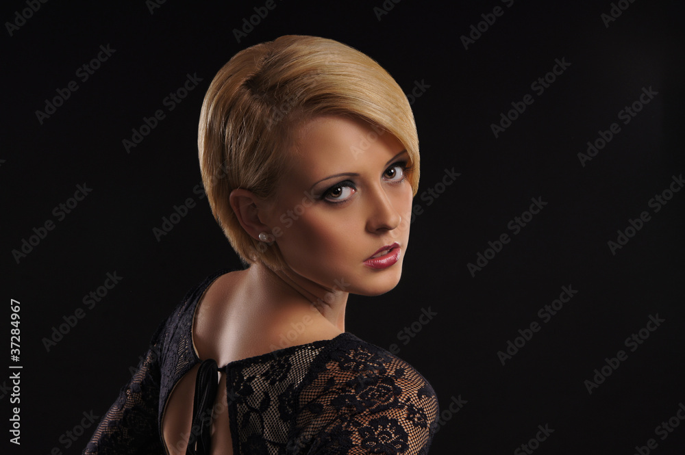 Young attractive blond over dark background Young attractive blond over dark background