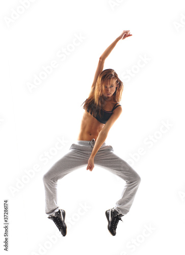 A young and attractive Caucasian dancing woman