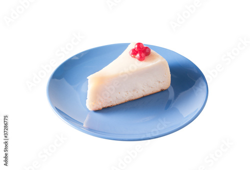 Cheesecake on the blue plate isolated on white