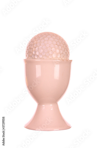 GOLFBALL IN AN EGG CUP