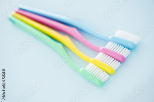 Four multicolored toothbrushes