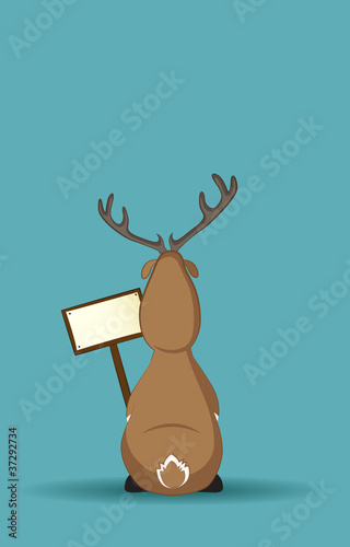 Reindeer sitting turned back with a sign