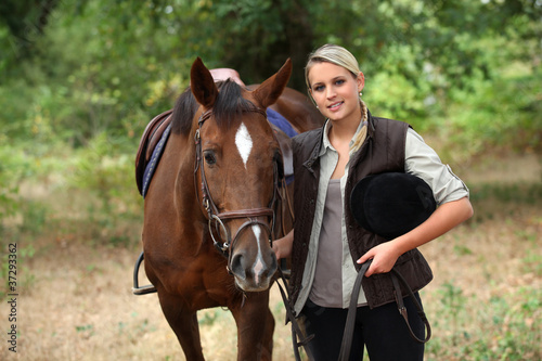 Blond teenager with horse