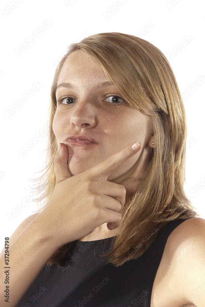 Young girl making facial expressions hands on chin Young girl making facial expressions hands on chin