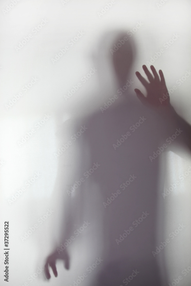 Person stood behind frosted glass Person stood behind frosted glass