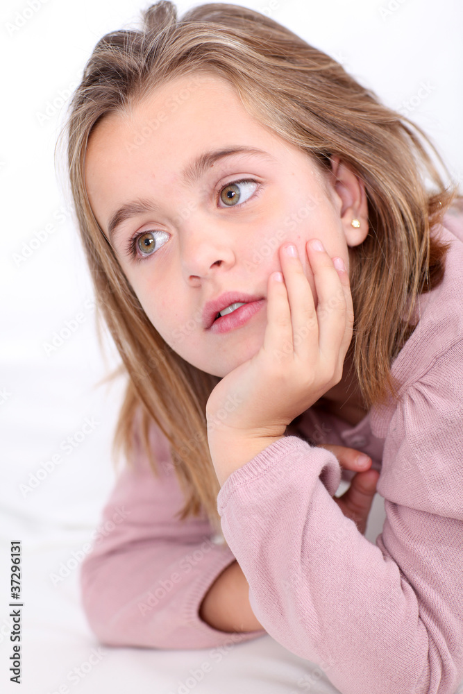 Portrait of cute little girl with hands on chin Portrait of cute little girl with hands on chin