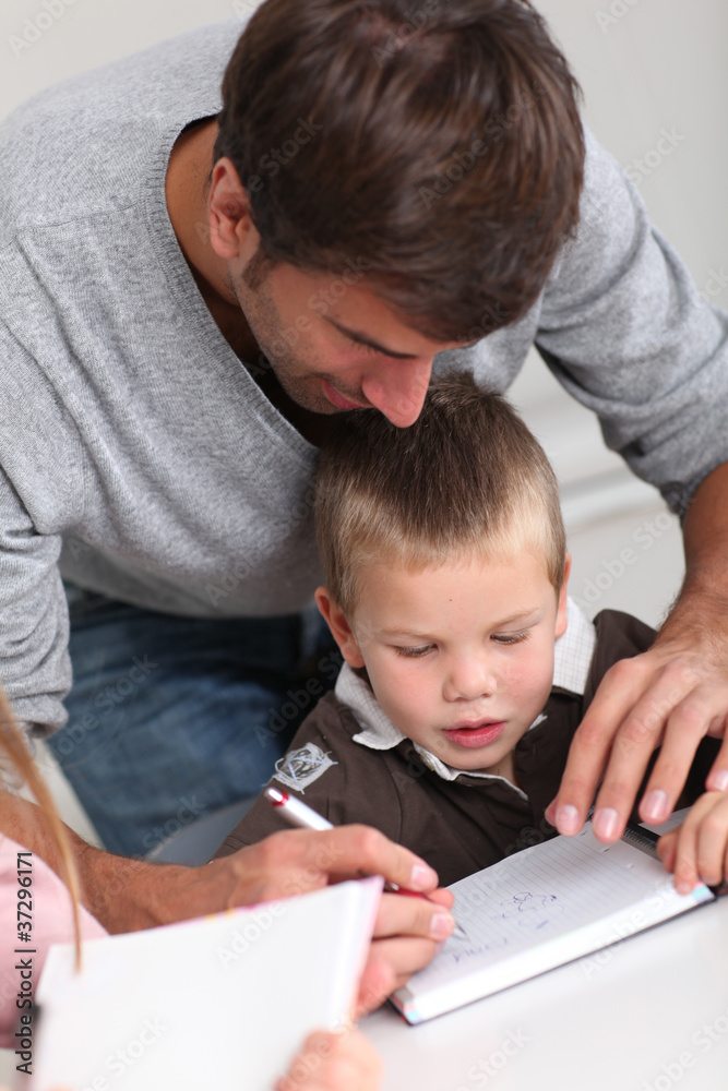 Man helping kids with homework Man helping kids with homework