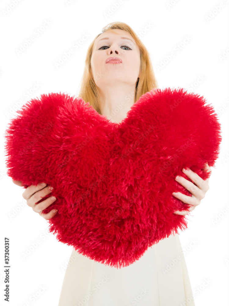 A woman holds a heart in his hands on a white background.