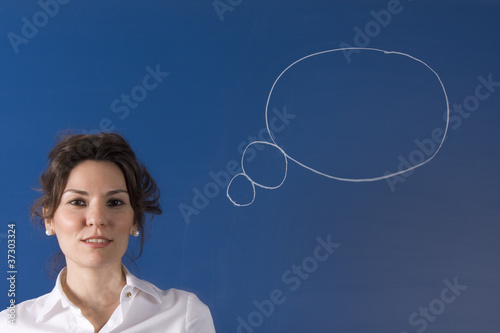 Image of young woman thinking on blue board