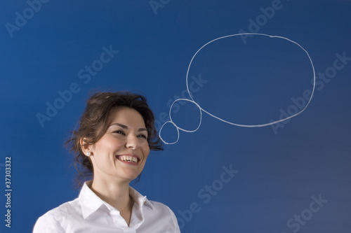 Image of young woman thinking on blue board