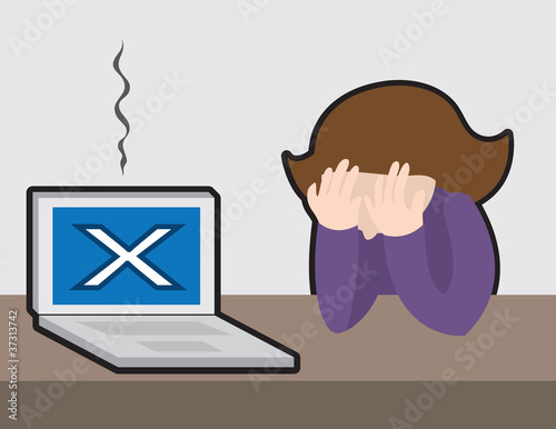 Woman with her head down upset at broken computer.