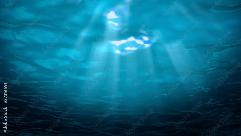 Underwater view of tropical sea looking up at the surface