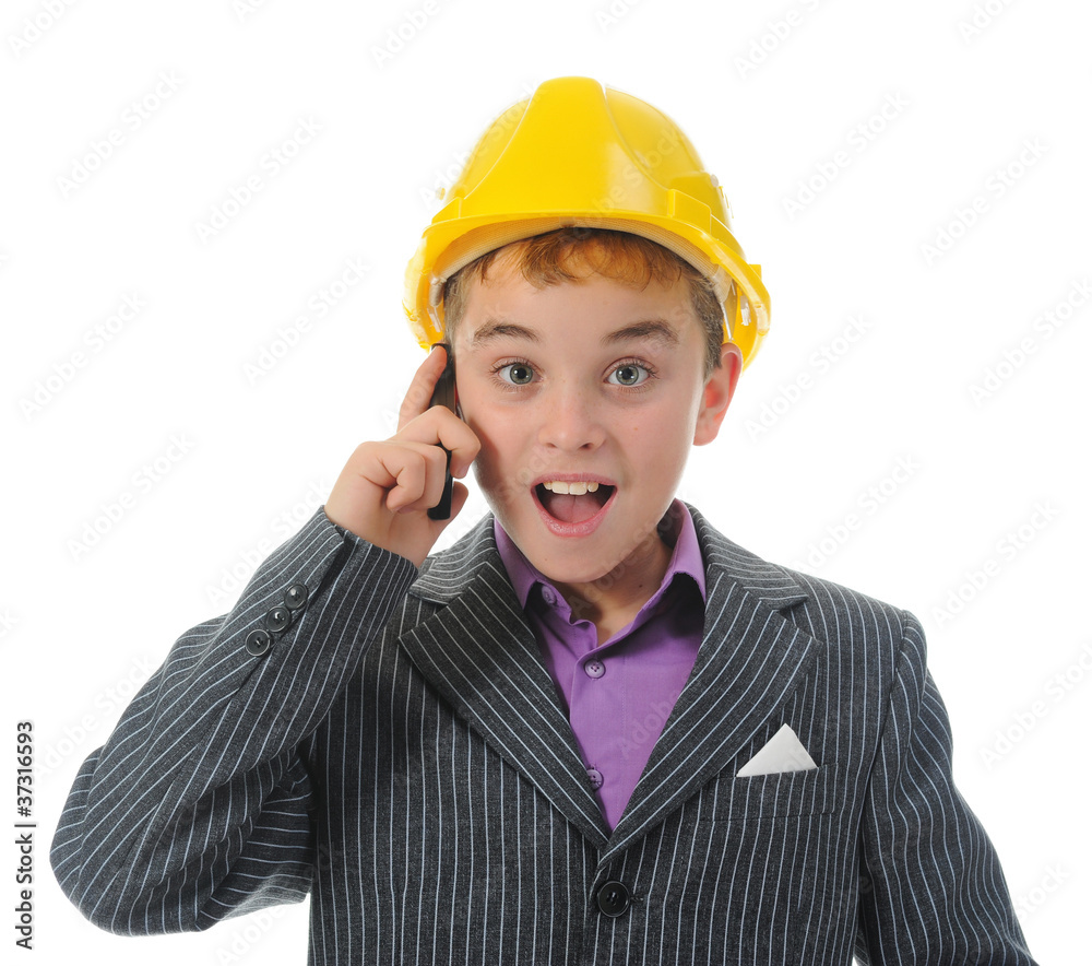 Little smiling builder in helmet
