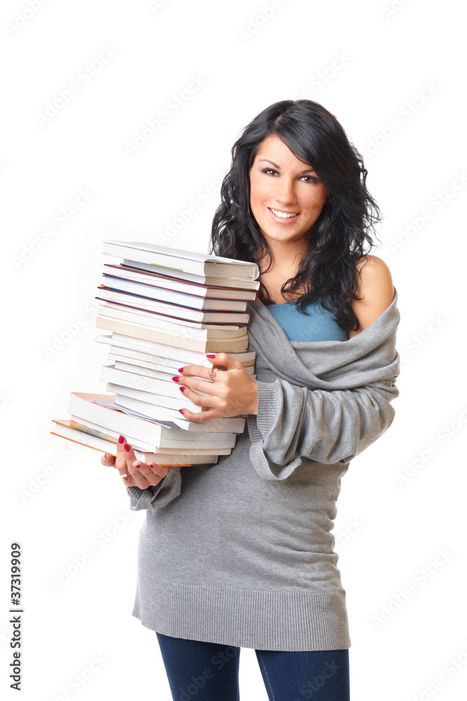 Beautiful young woman with stack of books on white background
