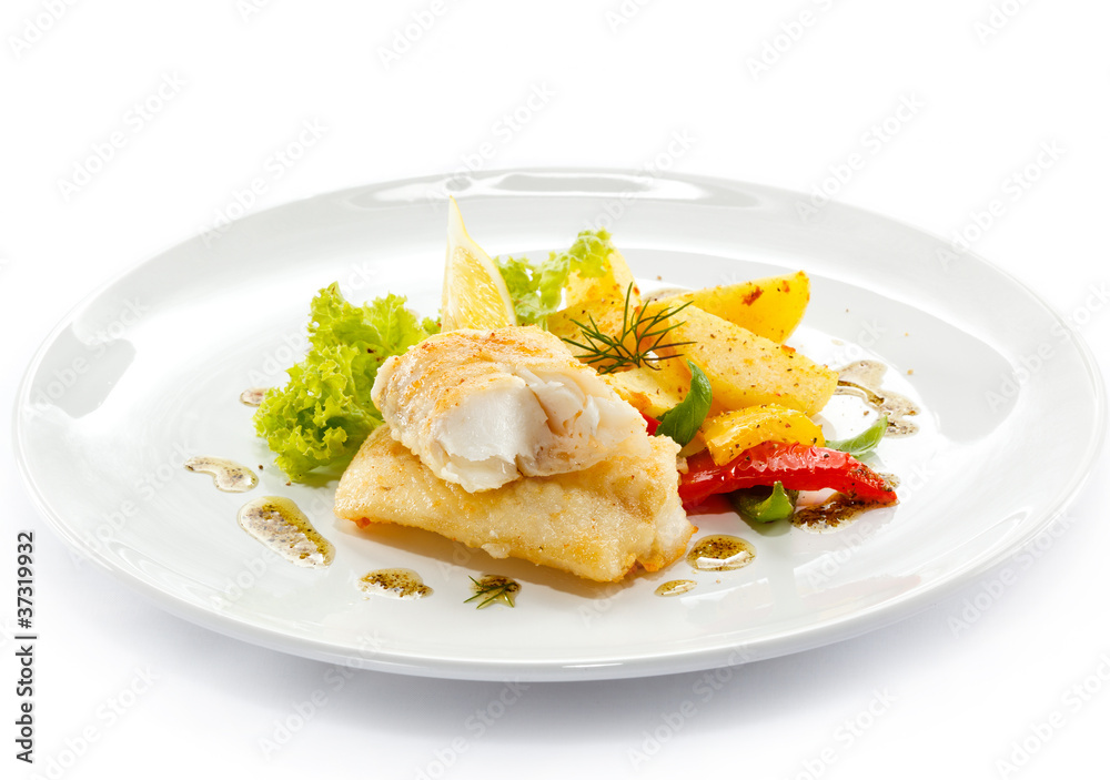 Fish dish - fried fish fillets and vegetables Fish dish - fried fish fillets and vegetables