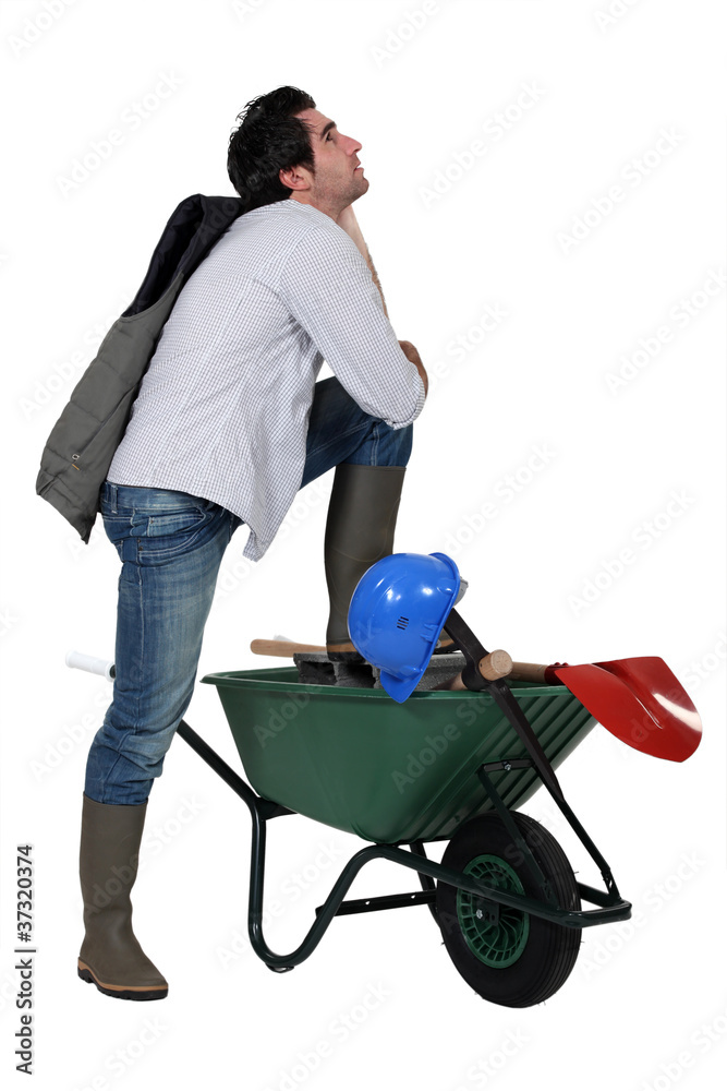 Man with wheelbarrow and spade Man with wheelbarrow and spade