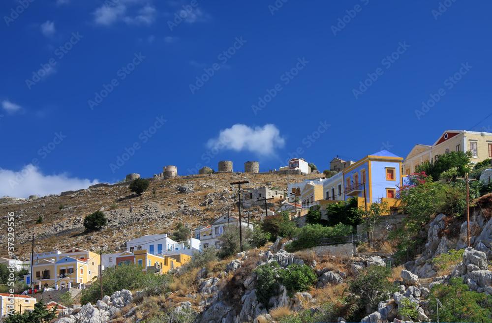 Greece. Dodecanesse.Island Symi (Simi).houses on rocks Greece. Dodecanesse.Island Symi (Simi).houses on rocks