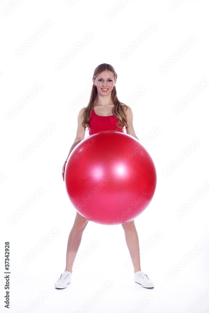 Model Frau in Sportoutfit mit Medizinball Porträt Model Frau in Sportoutfit mit Medizinball Porträt