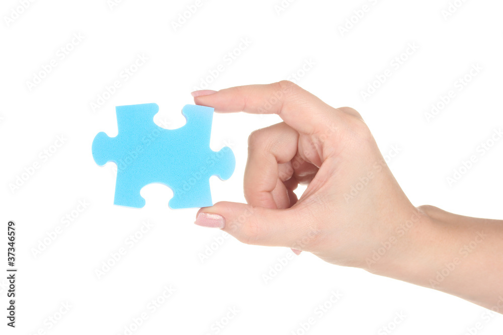 Blue puzzle with a hand isolated on white Blue puzzle with a hand isolated on white