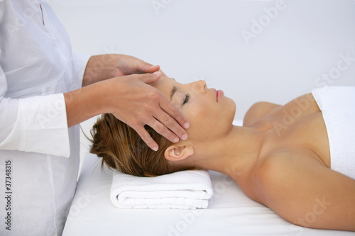 Woman being given head-massage
