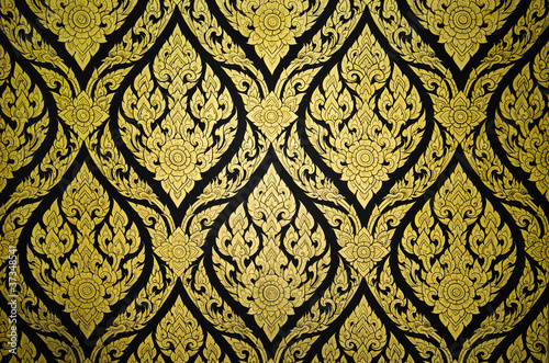 Photography Thai floral pattern textured on a wall
