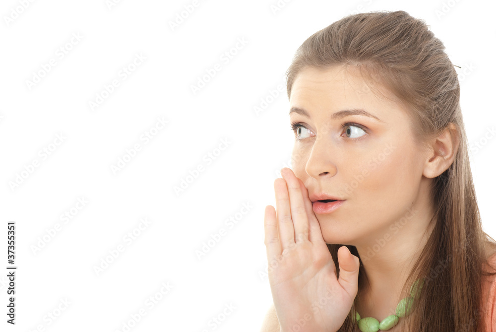 Closeup portrait of a young woman whispering gossips against whi Closeup portrait of a young woman whispering gossips against whi