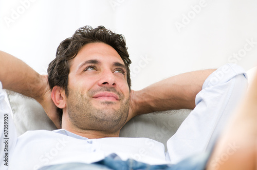 Smiling young guy relaxing