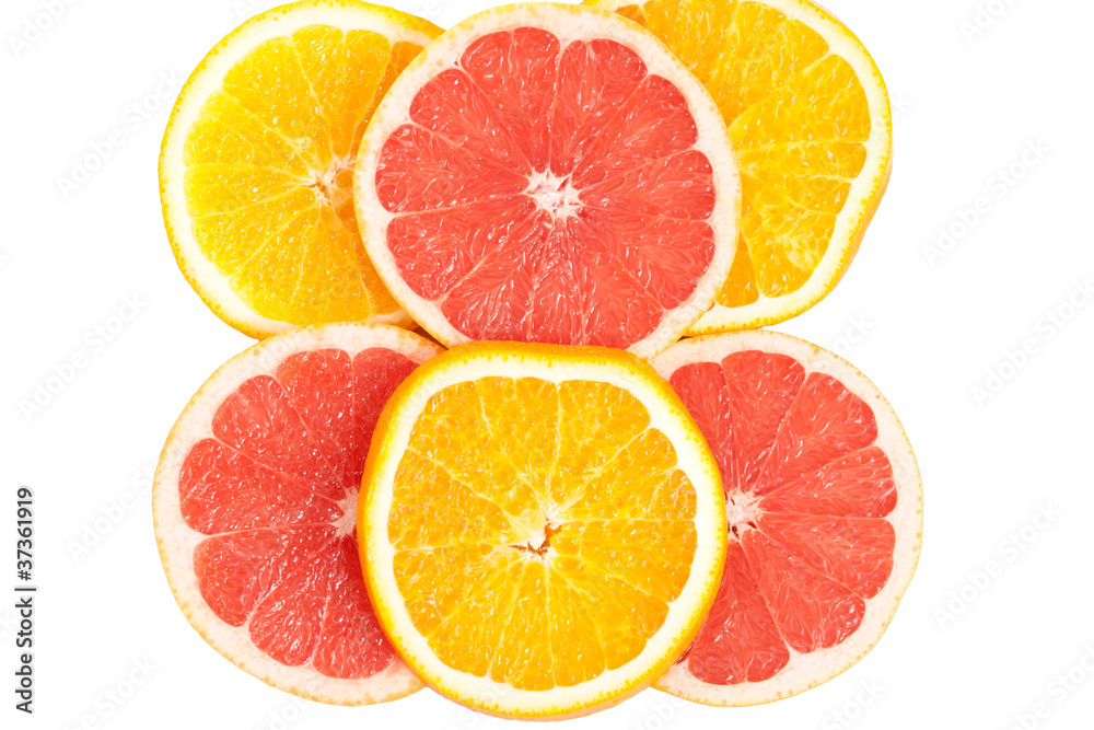Slices of various citruses on white Slices of various citruses on white