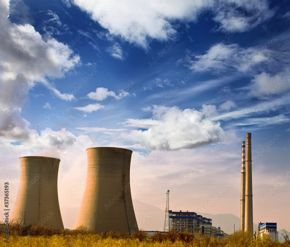 Landscape photo of industrial factory with power chimneys in blu Landscape photo of industrial factory with power chimneys in blu