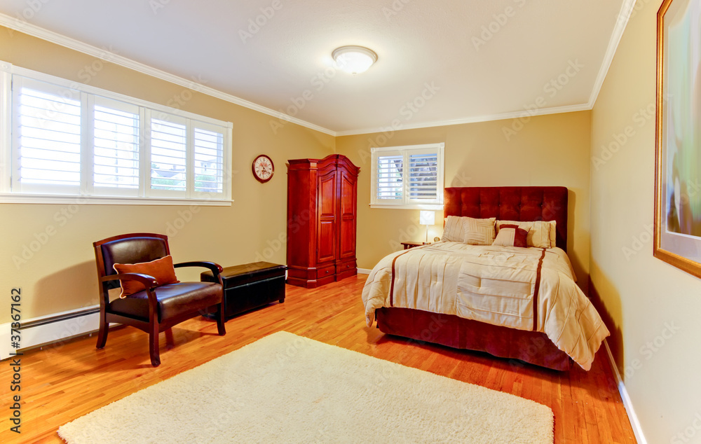 Nice large bedroom with red mahogany wood.