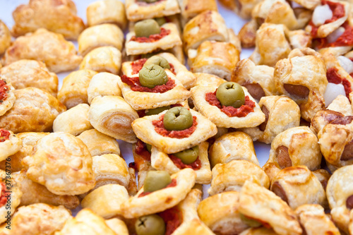 Cocktail snacks background on white table