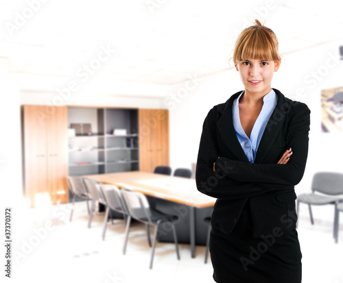 Confident businesswoman in her office © Minerva Studio