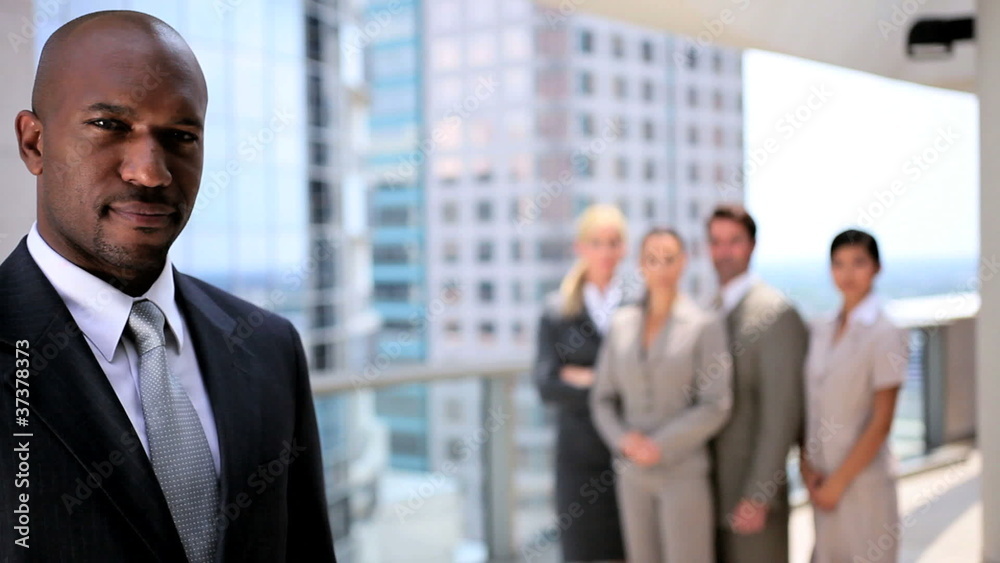 Successful Ethnic Business Eexecutive with his Team Successful Ethnic Business Eexecutive with his Team