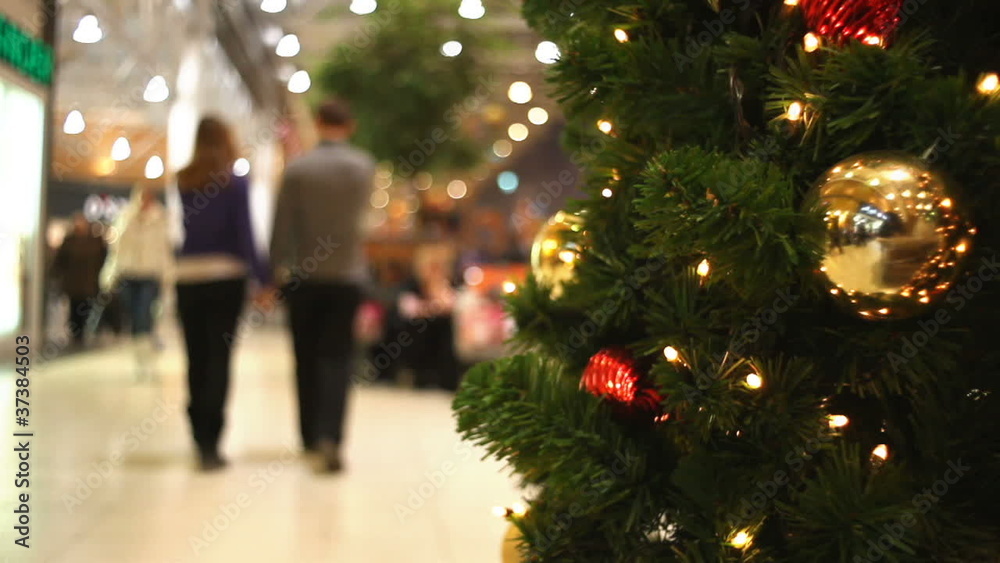 People walking in shopping centre at New Year's eve