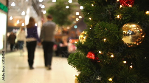 People walking in shopping centre at New Year's eve