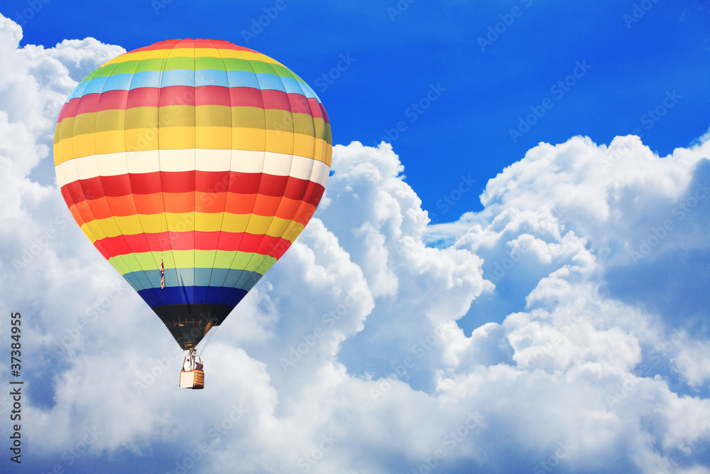 Fototapeta premium colorful hot air balloon on nice cloudy blue sky