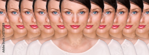 Fotografie Prety young woman standing with her clones against white backgro