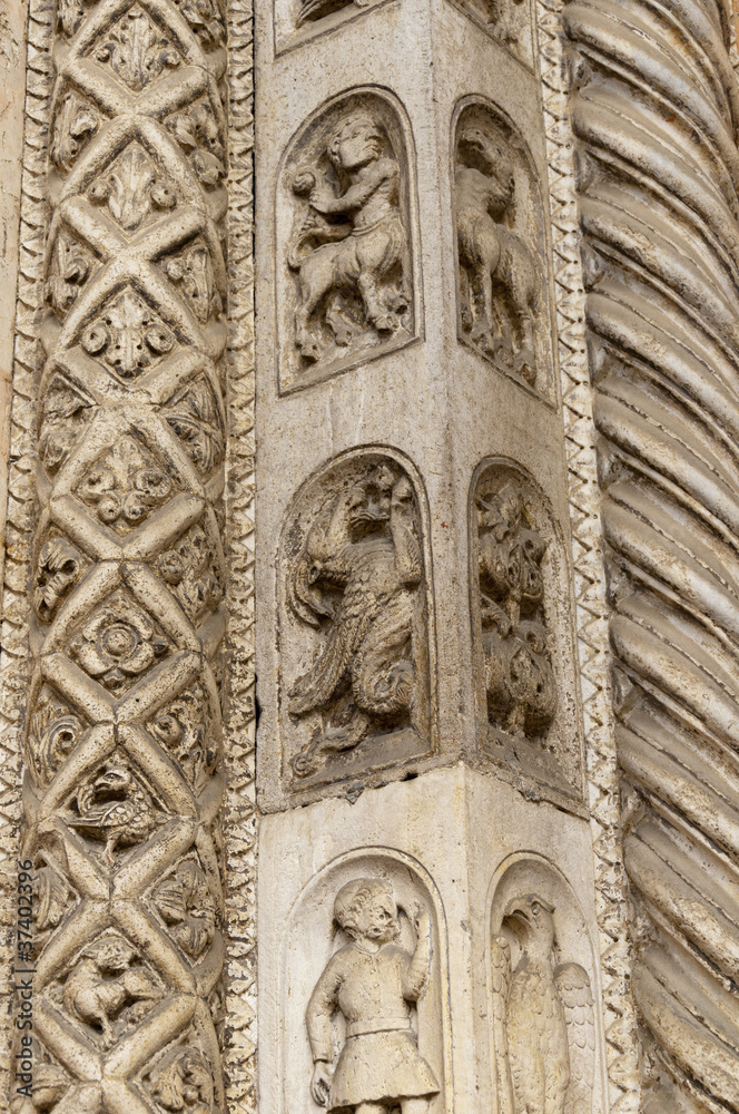 Carving on the Facade of the cathedral in Ferrara Italy