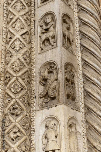 Carving on the Facade of the cathedral in Ferrara Italy