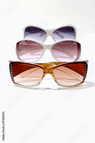 three different color lenses sunglasses isolated