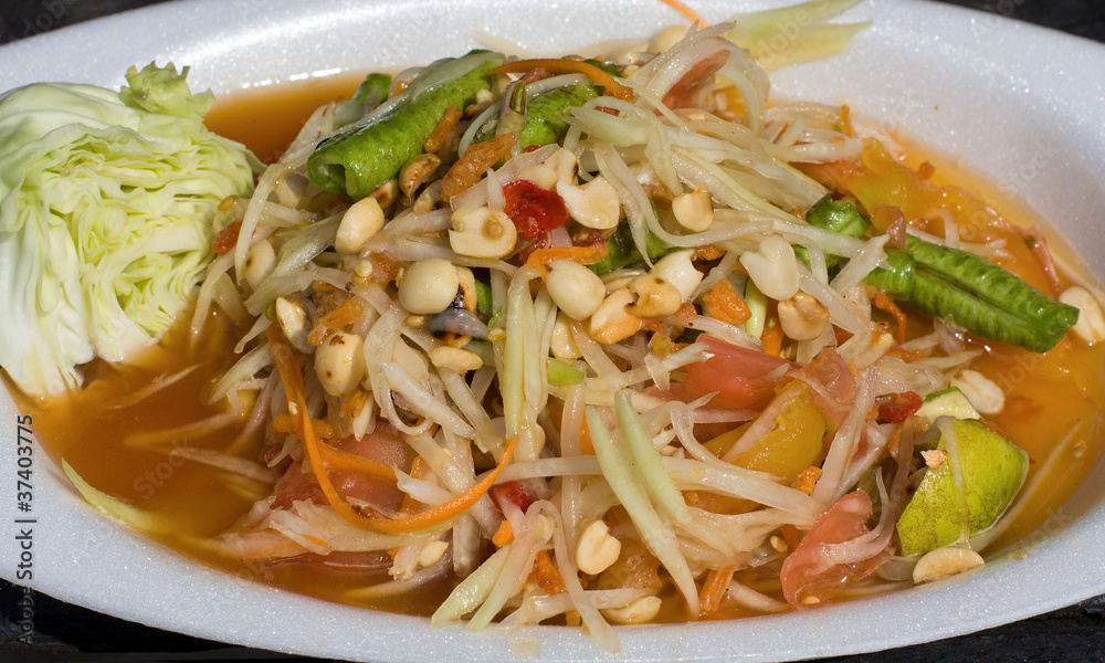 Thai papaya salad also known as Som Tam from Thailand. Thai papaya salad also known as Som Tam from Thailand.