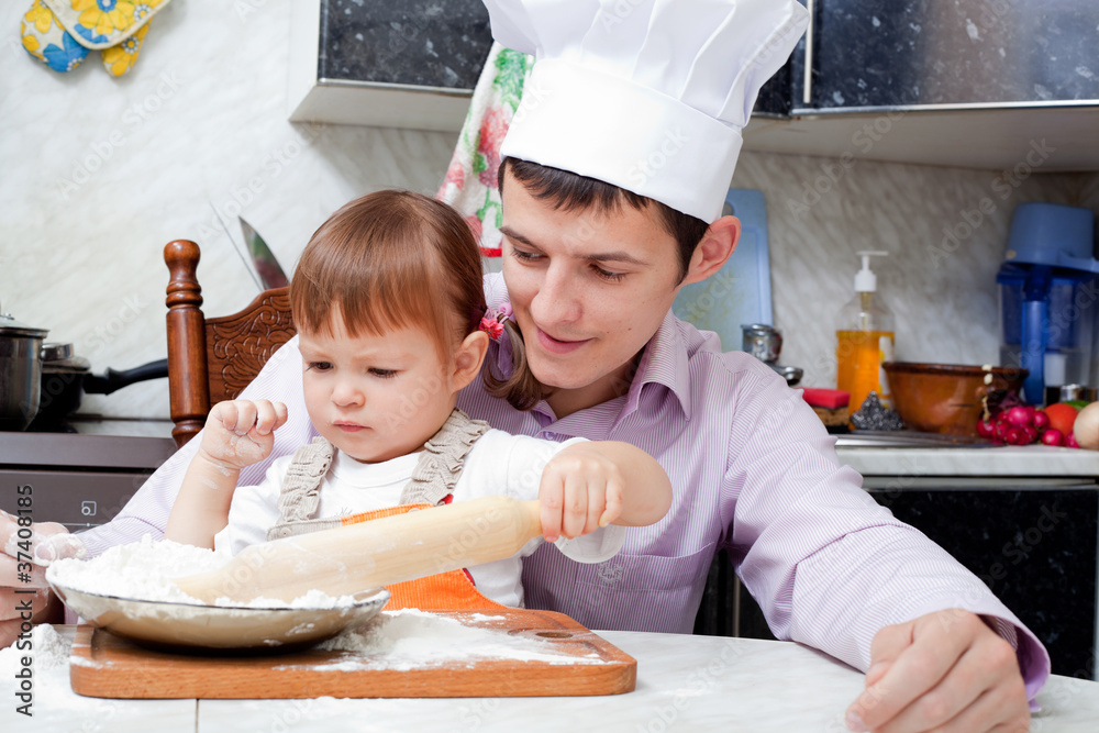 father with a small daughter do dough for pies father with a small daughter do dough for pies
