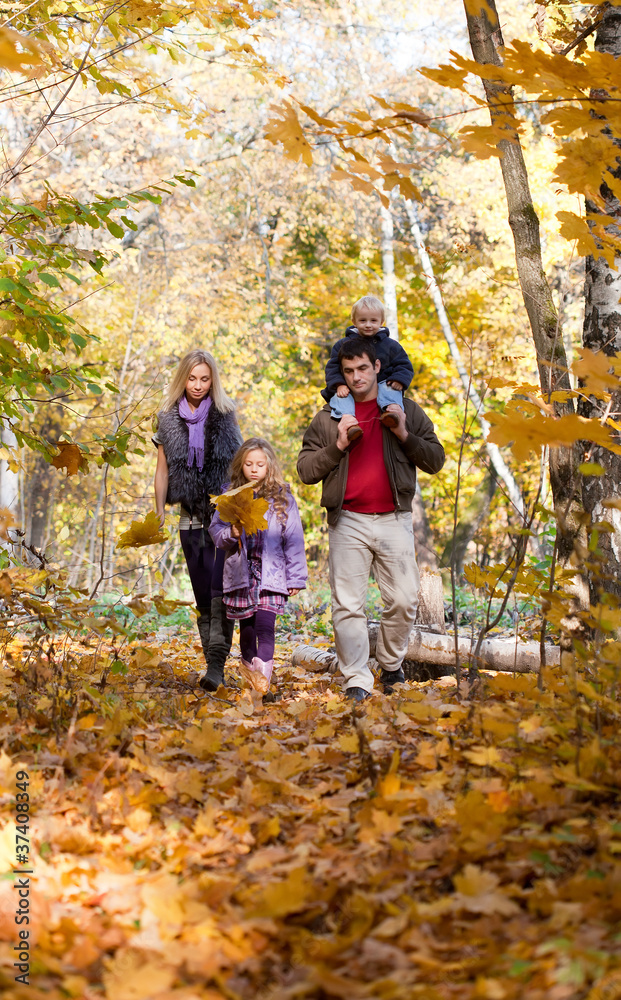 Family Enjoying Walk In Park Family Enjoying Walk In Park