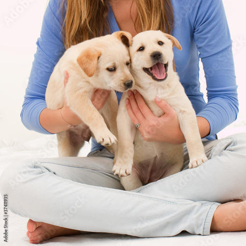 Best friends - young girl with cute puppies