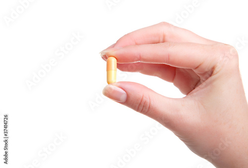 Quadro em tela pill in a hand on white background