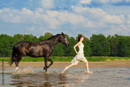 Woman on a horse by the sea