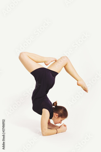 Gymnastic Girl over white background. Studio shot.