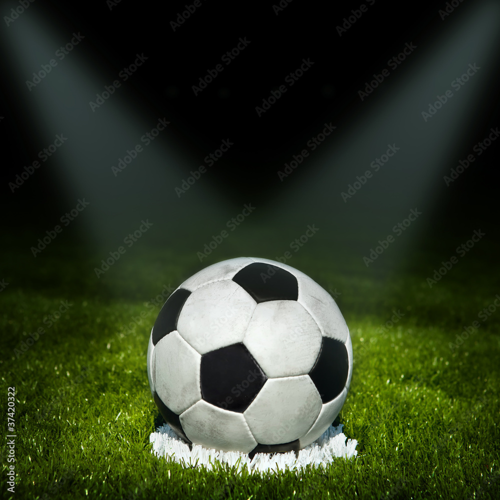 Naklejka premium football. Soccer ball on the field