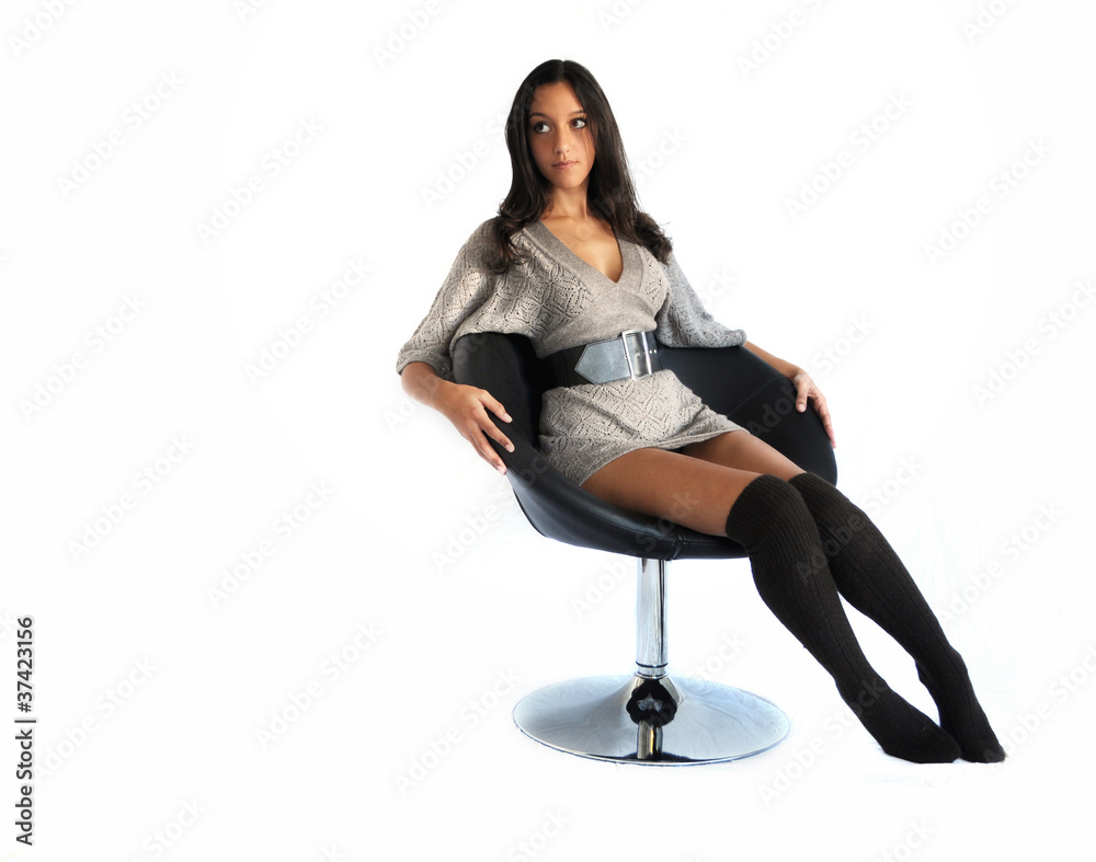 Beautiful woman / model relaxing on a chair