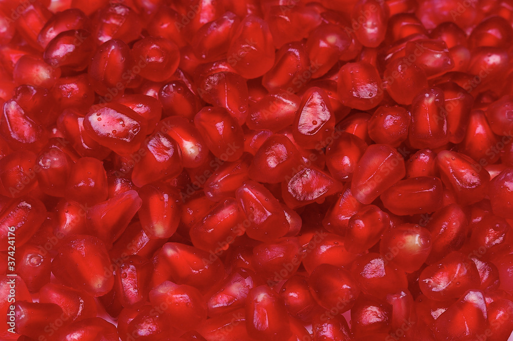 Closeup of red pomegranate seeds background Closeup of red pomegranate seeds background